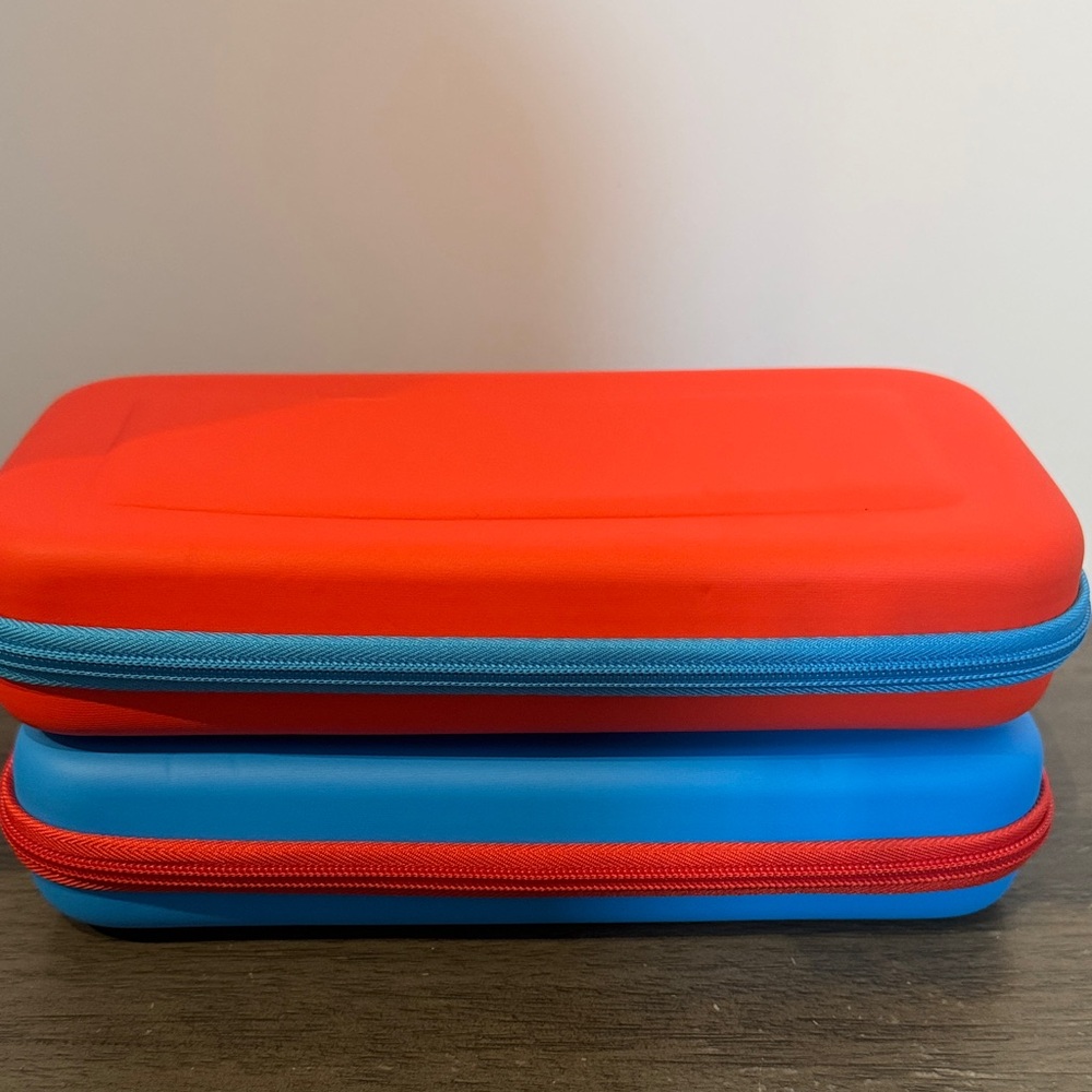 Nintendo switch portable storage lot of 2 red and blue case